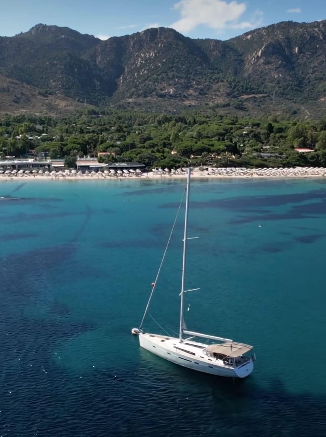 Bavaria 56 Cruiser at anchor &mdash; sunset sailing experience South Sardinia